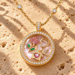 Keepsake Locket Rose Love Round macro close-up: floating rose, heart, love-letter and dove charms behind the pavé-framed glass