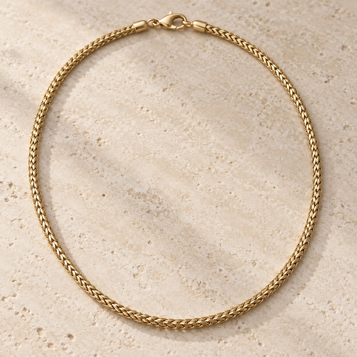 Bar None gold wheat chain necklace shown flat with lobster clasp