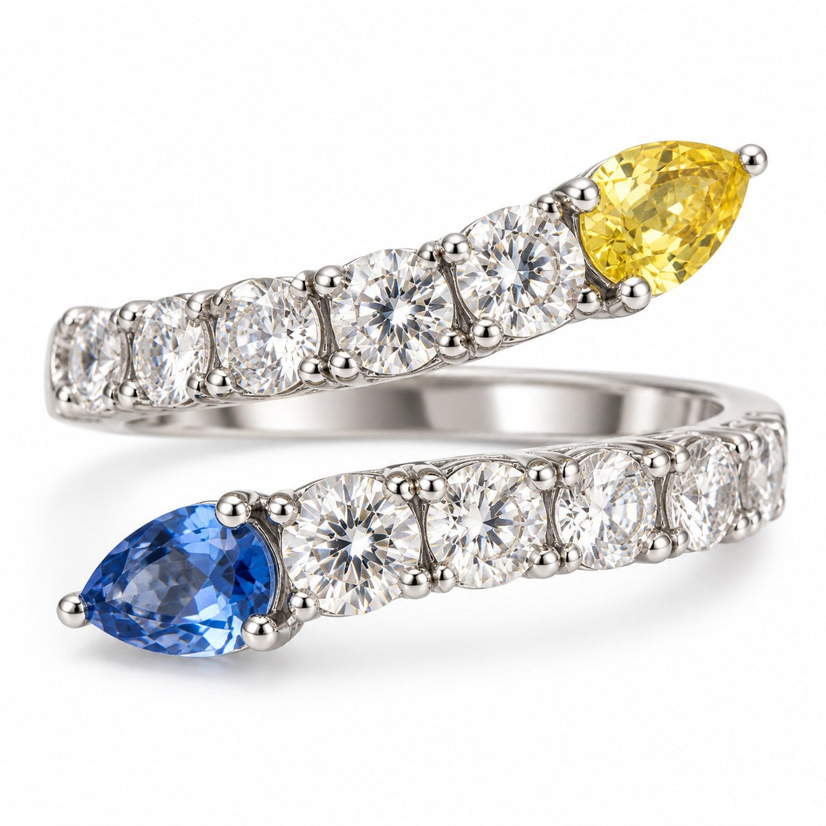 Close-up of the Opposites Attract bypass ring with yellow and blue pear-cut stones