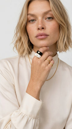 Collect the Shades black and white heart rings worn on model