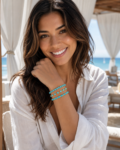 Ocean's Eleven turquoise Enamel Bar, Star and Tennis bracelets stacked on model